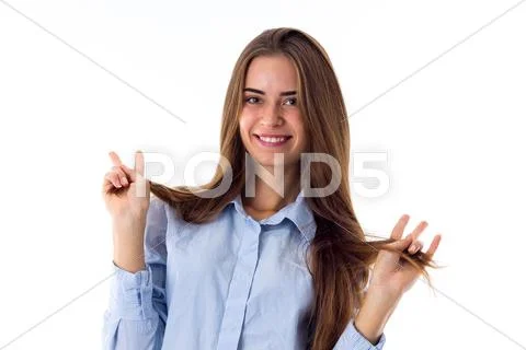 Smiling woman holding her hair Stock Photos