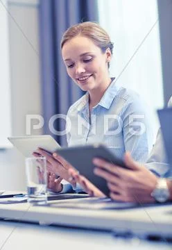 Smiling woman holding tablet pc computer Stock Photos