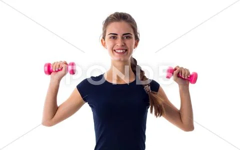 Smiling woman holding two dumbbells Stock Photos