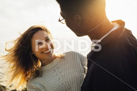 Smiling woman looking at her boyfriend Stock Photos