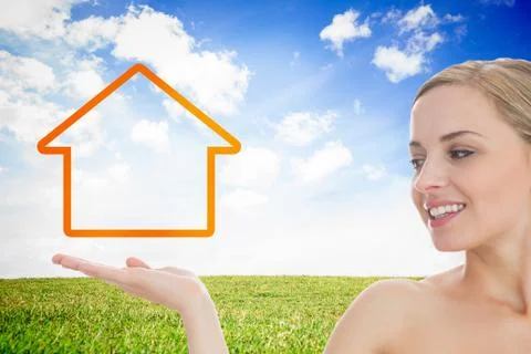 Smiling woman looking at house outline Stock Photos