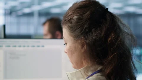 Smiling woman at PC checking servers bottlenecks leading to malfunctions Stock Footage 319241553