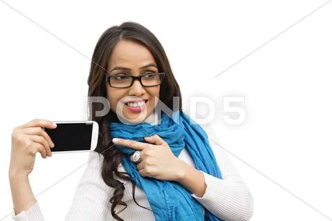 Smiling woman pointing at a mobile phone Stock Photos