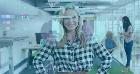 Smiling woman presenting tech data in office, interacting with floating graphs Stock Footage 307469036