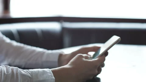 Smiling woman scrolling messages on phone, chatting with friends, social network Stock Footage 106267853
