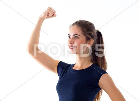 Smiling woman showing biceps Stock Photos