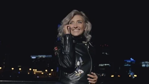 Smiling woman speaking on phone Stock Footage