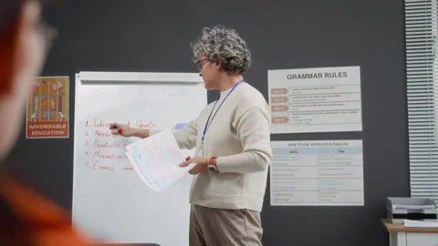 Smiling Woman Teaching Class in Prison with Inmates Listening Stock Footage 328995878