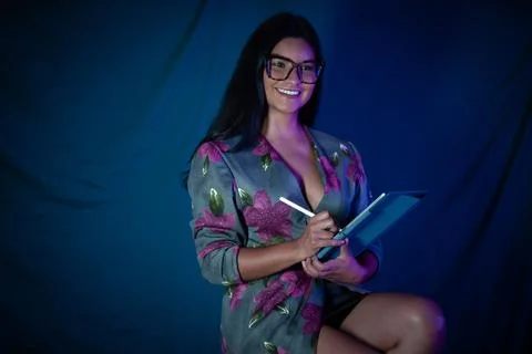 Smiling woman using tablet creating digital artwork Stock Photos