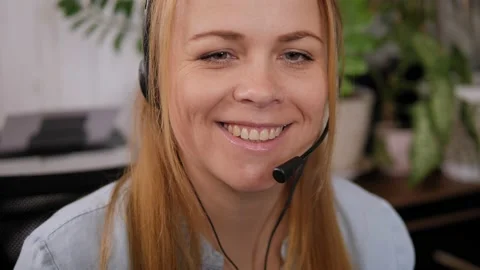 Smiling woman working as customer support operator with headset in a call center Stock Footage 201229165