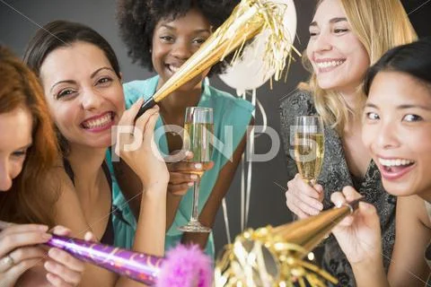 Smiling women celebrating at party Stock Photos