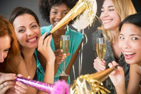 Smiling women celebrating at party Stock Photos