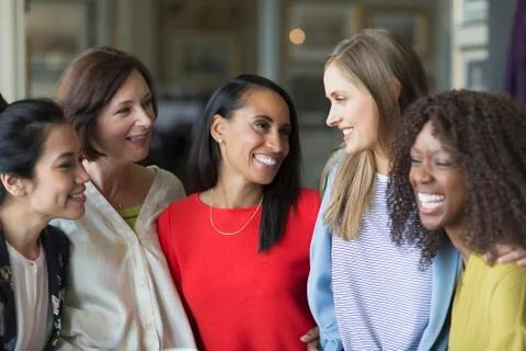 Smiling women friends talking and laughing Stock Photos