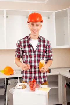 Smiling worker dines Stock Photos
