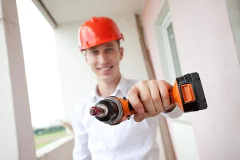 Smiling worker with drill Stock Photos