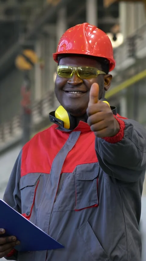 Smiling Worker in Protective Workwear Looking at Camera and Giving Thumb Up Stock Footage 312734347