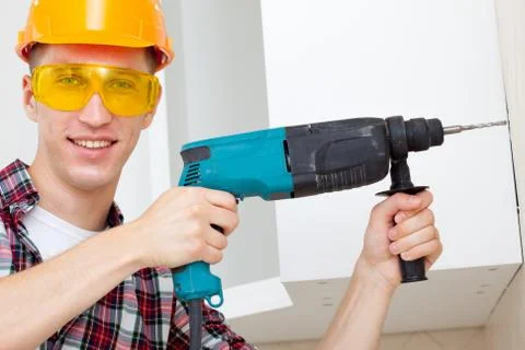 Smiling worker with rock-drill Stock Photos