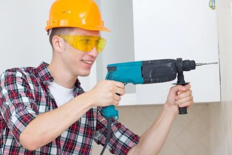 Smiling worker with rock-drill Stock Photos