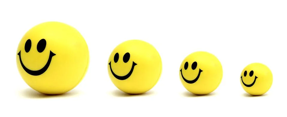 Smiling yellow balls Foto stock