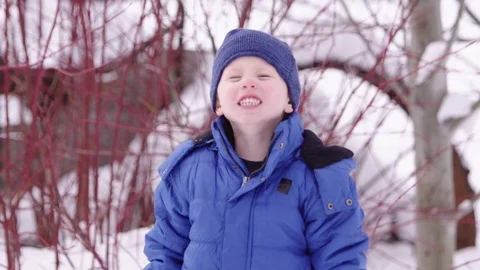 Smiling young boy in the winter Stock Footage 80127743