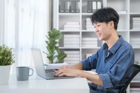 Smiling young businessman checking schedule, planning workday at his office.. Foto stock