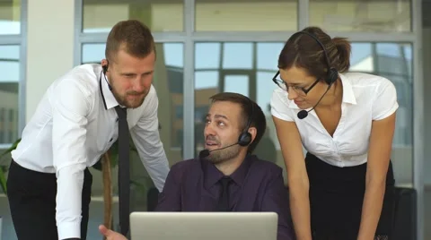 Smiling young call center agents at work Stock Footage 67665635