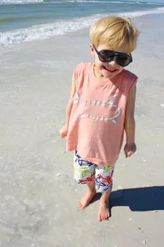 Smiling young child on beach Stock Photos