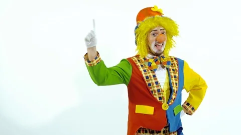 Smiling young clown trying to count up to ten on his fingers Stock-Footage 70285693