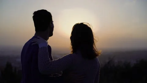 Smiling young couple having fun dancing together at sunset Stock Footage 133280655