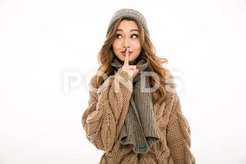 Smiling young cute woman showing silence gesture. Stock Photos