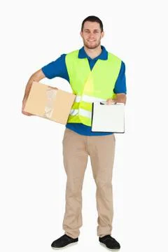 Smiling young delivery man asking for signature Stock Photos