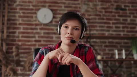 Smiling young female tutor talking to web camera. Recording vlog, online video Stock Footage 160841535
