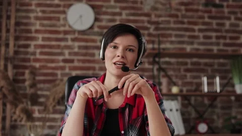 Smiling young female tutor talking to web camera. Recording vlog, online video Stock-Footage 166098663