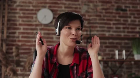 Smiling young female tutor talking to web camera. Recording vlog, online video Stock Footage 171615933