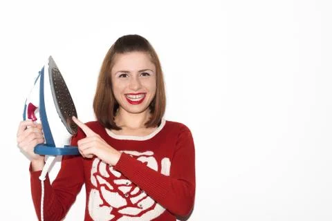 Smiling young girl ironing with iron isolated Stock Photos