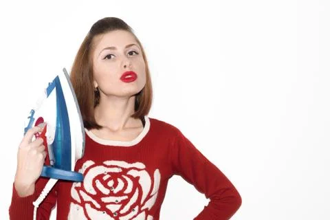 Smiling young girl ironing with iron isolated Stock Photos