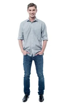 Smiling young guy over white background Stock Photos
