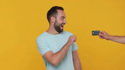 Smiling young man 20s in basic casual blue t-shirt posing isolated on yellow Stock Footage 148291305