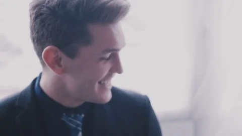 Smiling young man close-up Stock Footage 76510936