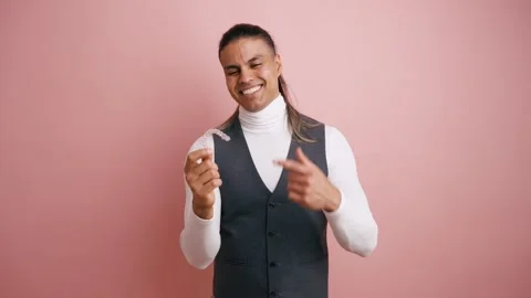 Smiling young man holding an invisible dental aligner Stock Footage 335275157