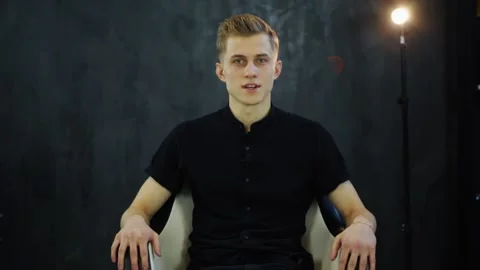 Smiling young man look at camera and recording vlog in loft studio Video stock 131548645