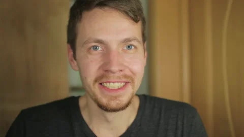 Smiling young man looking at mirror, getting ready for new day in bathroom. Stock Footage 266089643