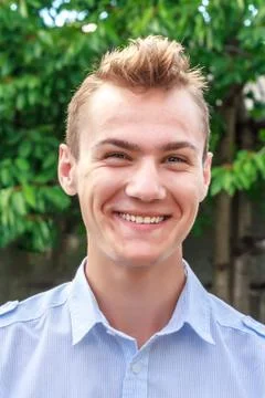 Smiling young man Stock Photos