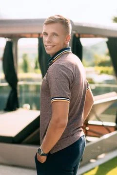 Smiling young man posing at the hotel. Stock Photos