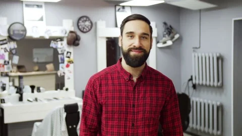 Smiling young man showing thumb up indoors Stock Footage 70685973