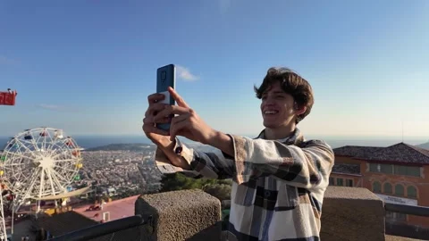 Smiling young man taking a selfie in slow motion Stock Footage 293169704