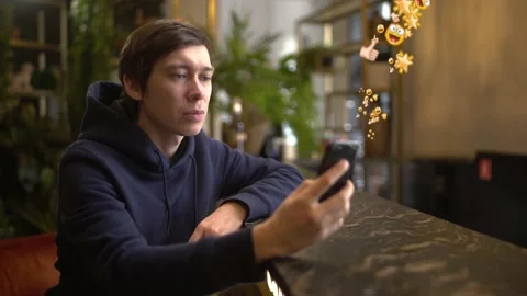 Smiling Young Man Using Phone Feels Happy, Having Fun. Vlogger Influencer Stock Footage 140036929