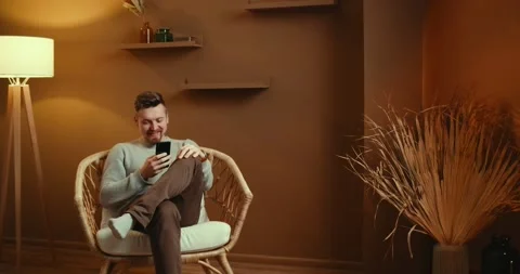 Smiling young man using smartphone indoors. Millennial businessman mobile Stock Footage 219741793