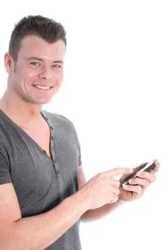 Smiling young man using a smartphone Stock Photos