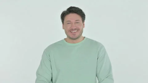 Smiling Young Man on White Background Video stock 230509566